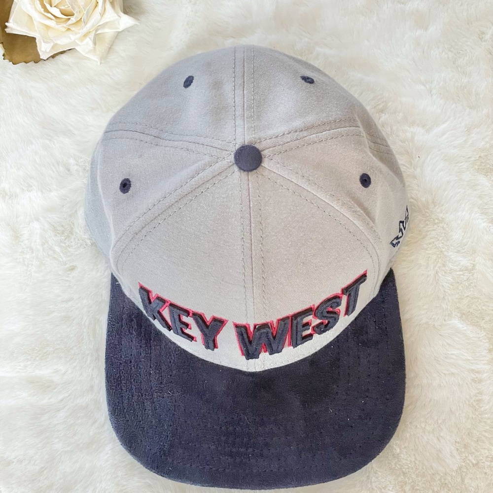New with tags ESSENTIALS KEY WEST HAT GREY with Navy Blue and red. Adjustable.